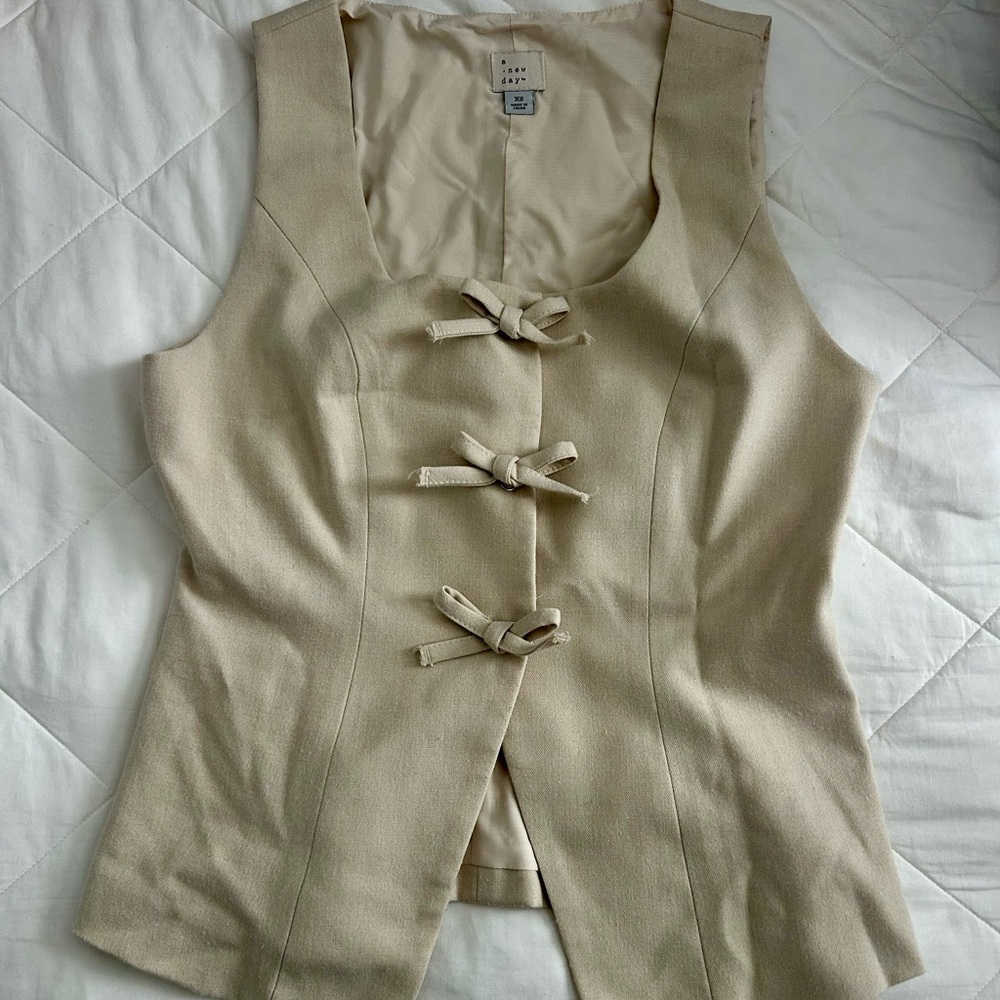 a new day Cream Sleeveless Top with Bow Accents